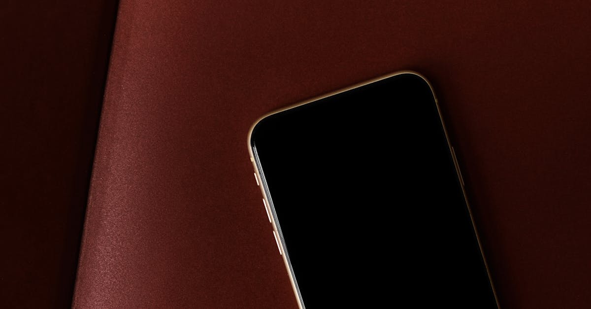 A sleek smartphone positioned on a rich brown leather background, highlighting modern design.