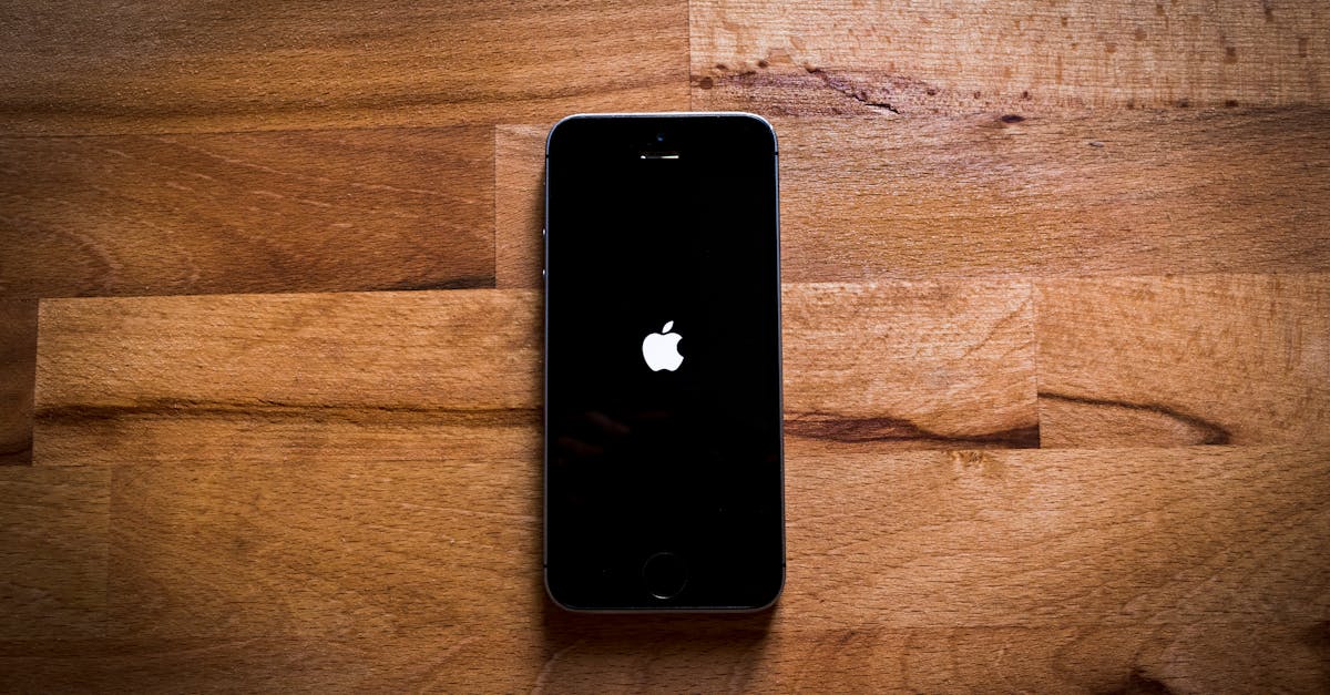 Close-up of a smartphone on a textured wooden surface, featuring a sleek design.
