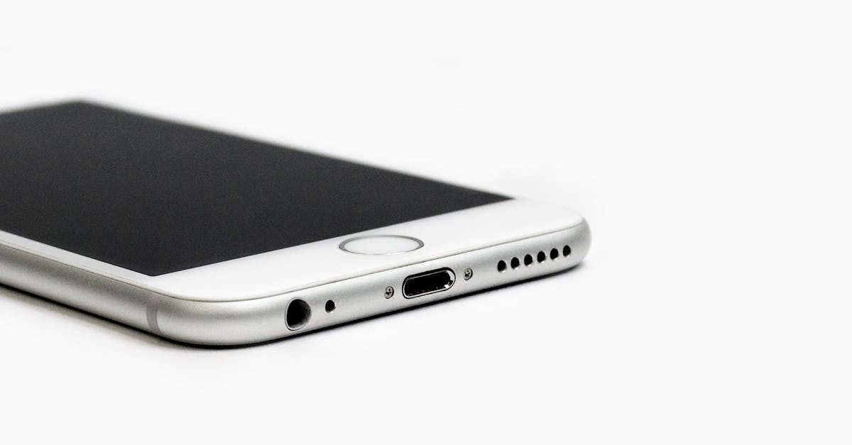 Minimalist image of a sleek smartphone with focus on the bottom edge and ports.