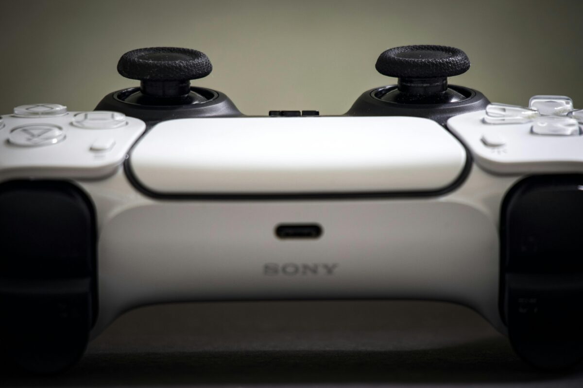 Detailed view of a Sony PlayStation 5 DualSense controller, highlighting design and features.