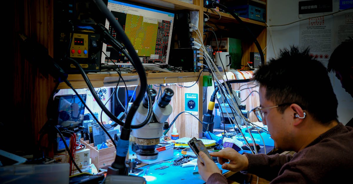 A technician diligently repairs a circuit board at a well-equipped workstation using advanced tools and equipment.