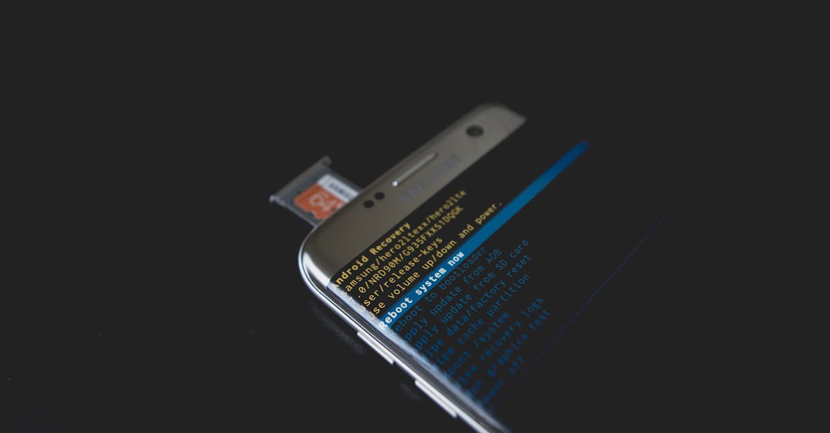 Close-up of a smartphone displaying Android recovery mode with an SD card inserted.