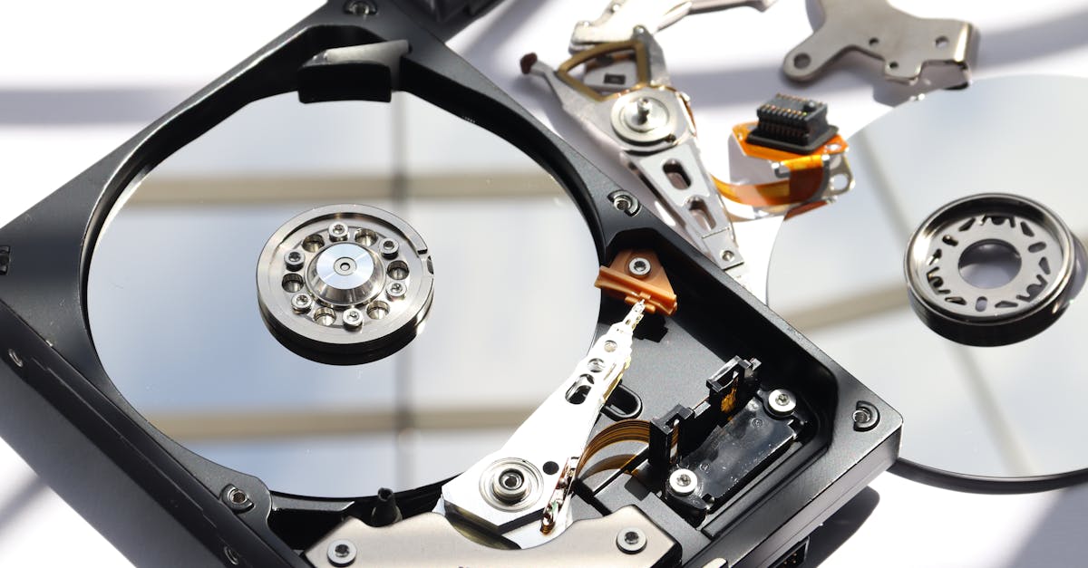 Detailed view of disassembled HDD showing intricate internal components.