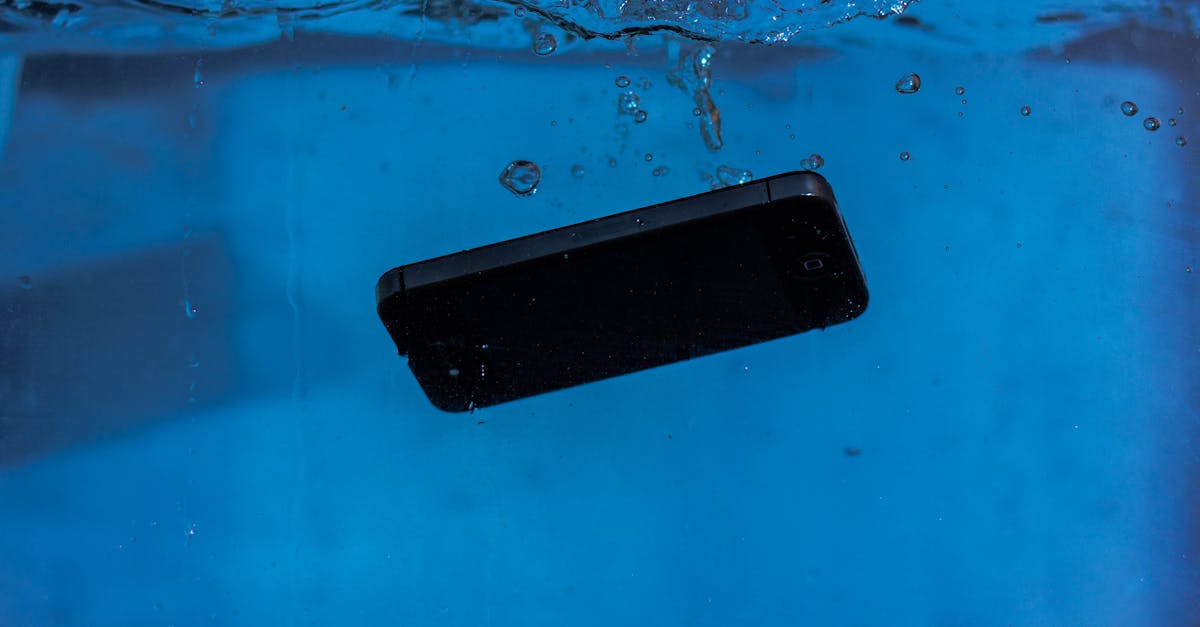 A smartphone captured underwater, illustrating themes of technology and water resistance.